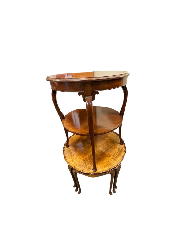 Walnut circular nest of five table and mahogany circular two tier occasional table.