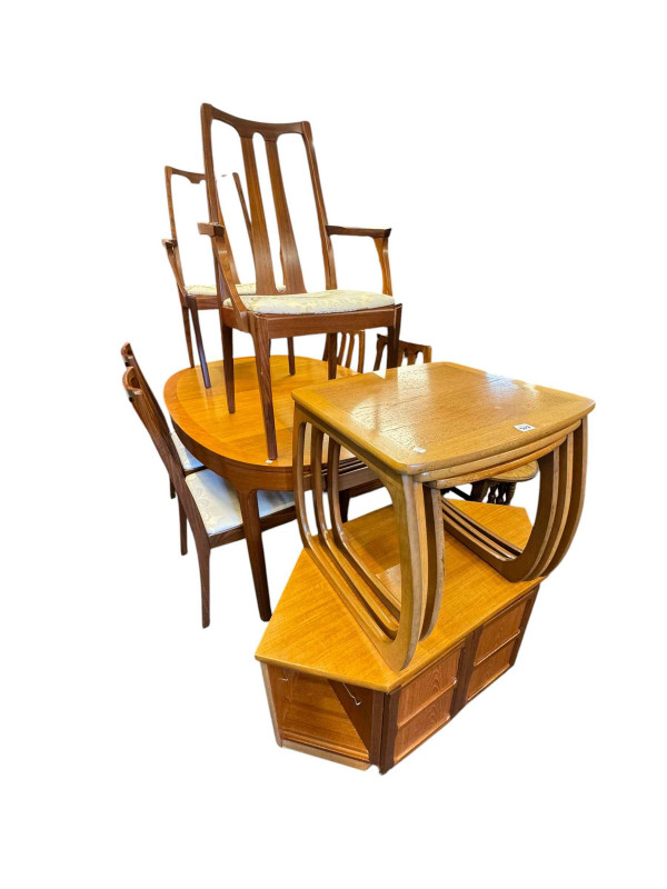 Mid Century teak oval extending dining table with six Nathan rosewood chairs, corner cabinet, television stand and nest of three tables.