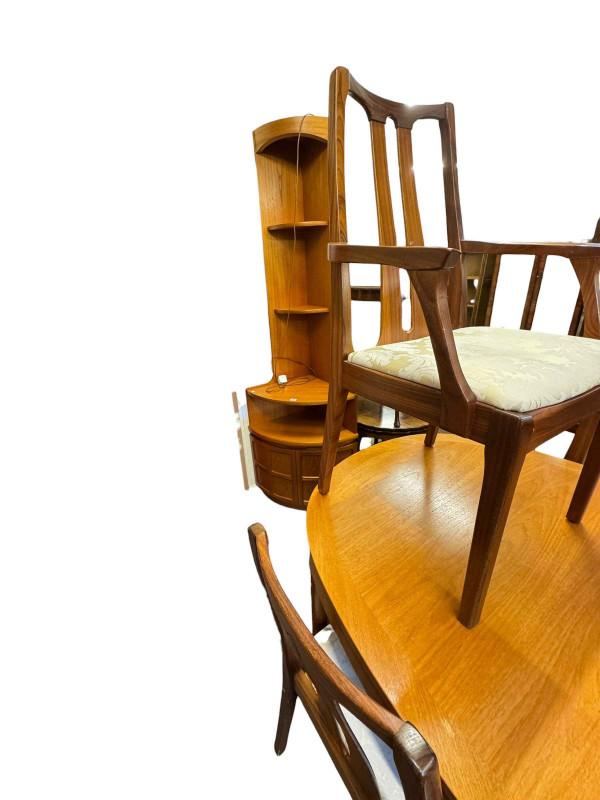 Mid Century teak oval extending dining table with six Nathan rosewood chairs, corner cabinet, television stand and nest of three tables.