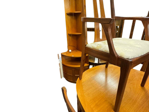 Mid Century teak oval extending dining table with six Nathan rosewood chairs, corner cabinet, television stand and nest of three tables. thumbnail