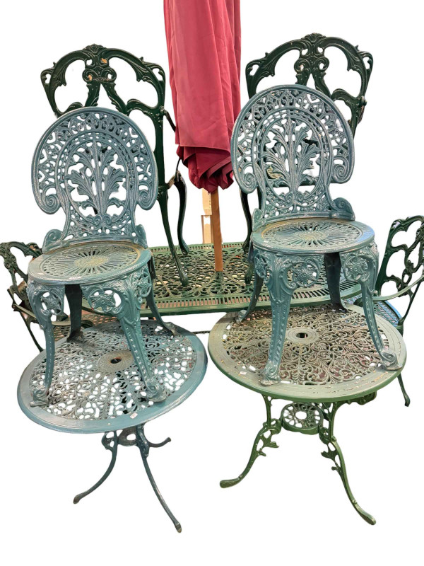 Cast aluminium garden table and four chairs, two smaller circular garden tables, pair of chairs and garden parasol.