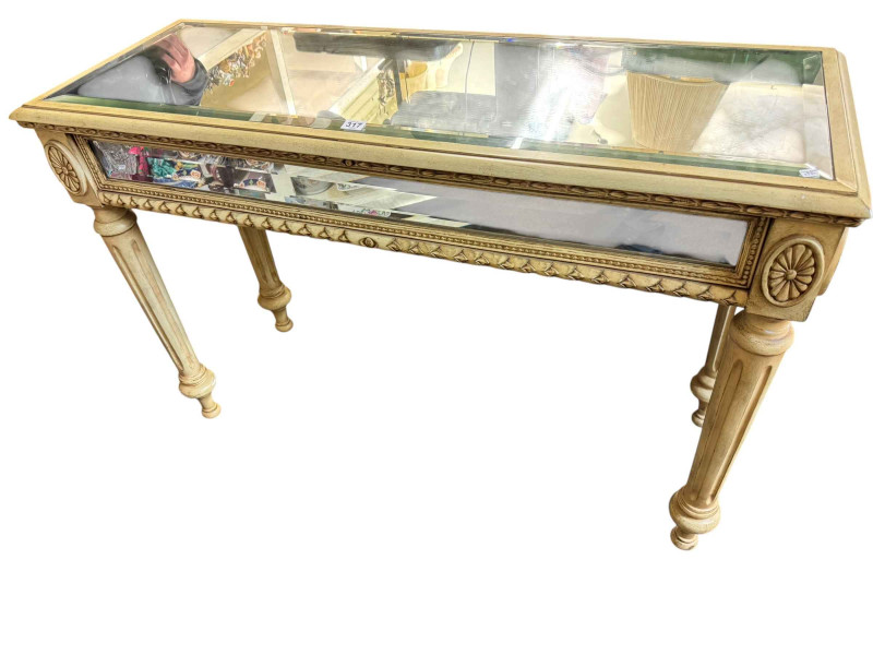 Mirrored top console table raised on four reeded tapering legs.