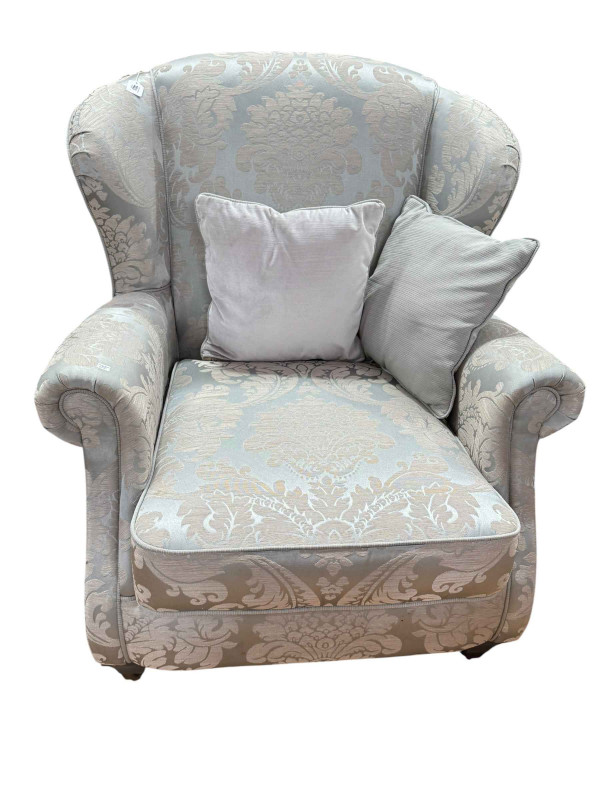 Two Knoll style settees and easy chair in brocade upholstery with cushions.