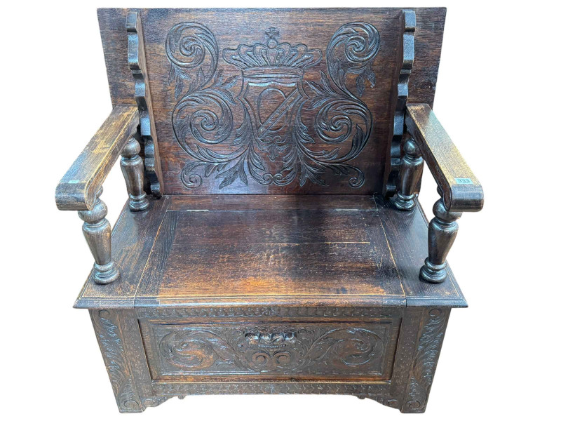 Carved oak monks bench, 92cm wide.