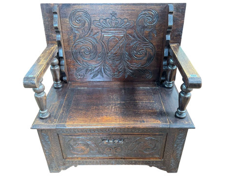 Carved oak monks bench, 92cm wide.