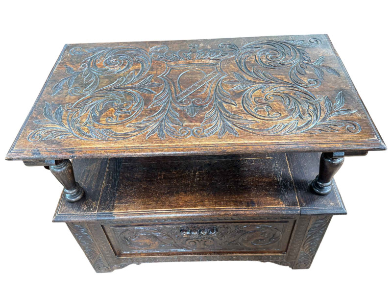 Carved oak monks bench, 92cm wide.