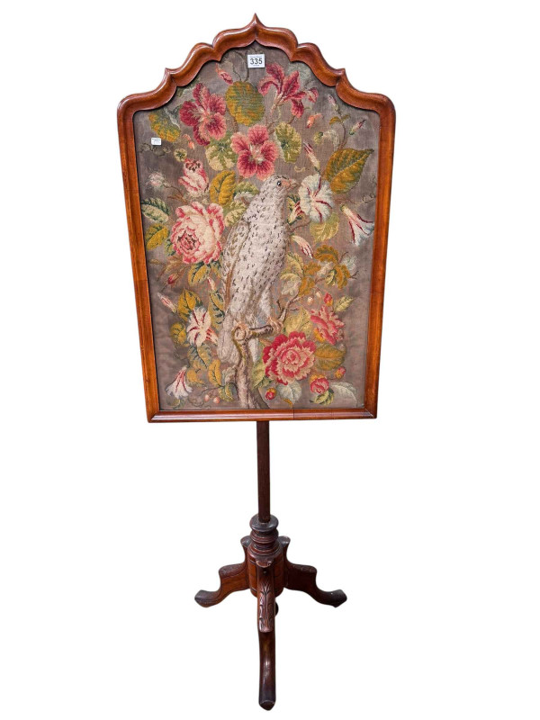 Victorian needlework pole screen on tripod base.