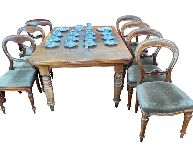 Late Victorian extending dining table along with seven Victorian chairs.