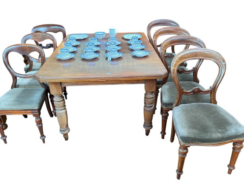 Late Victorian extending dining table along with seven Victorian chairs.