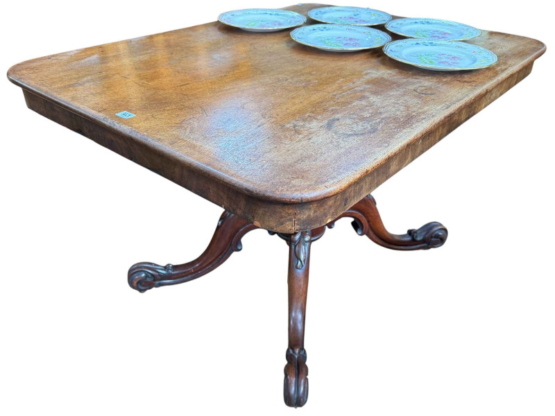 Victorian mahogany breakfast table on carved base.