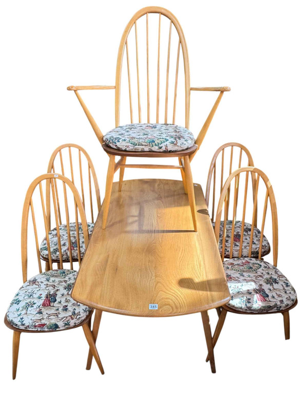 Ercol beech and elm drop leaf table and five Windsor chairs.