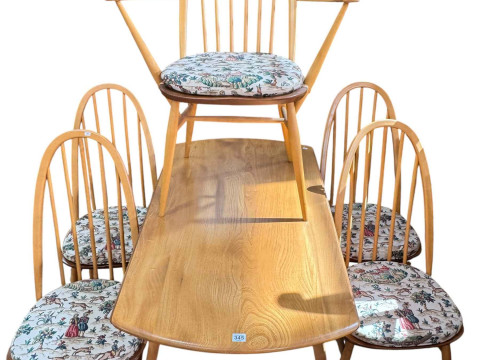 Ercol beech and elm drop leaf table and five Windsor chairs.