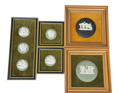 Five framed Wedgwood Jasperware plaques.