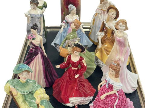 Eleven Royal Doulton figures and poppy sleeve vase (12).