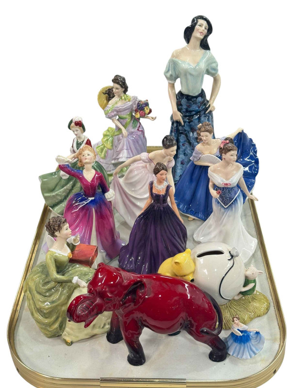 Ten Royal Doulton figures, Winnie the Pooh money box, and Flambé Elephant (12).