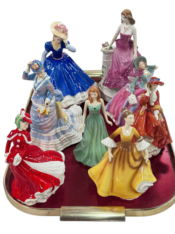 Seven Royal Doulton figures and Royal Worcester Midnight Rendezvous figure (8).