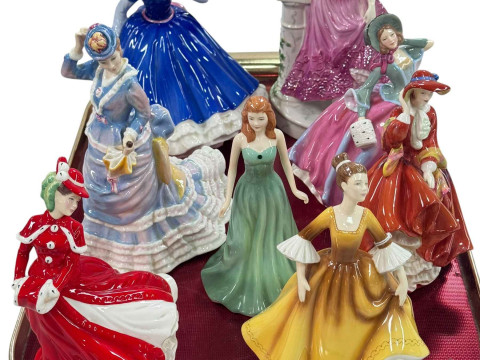 Seven Royal Doulton figures and Royal Worcester Midnight Rendezvous figure...