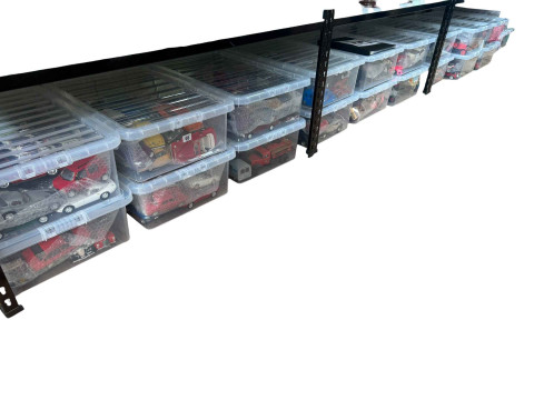 Twenty two boxes of made up models of various vehicles.