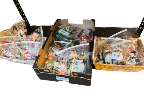 Three boxes of costume dolls from around the World.