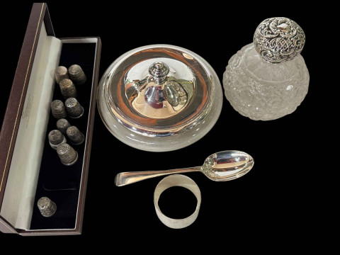 Silver lidded powder bowl and scent bottle, silver napkin ring and spoon,...