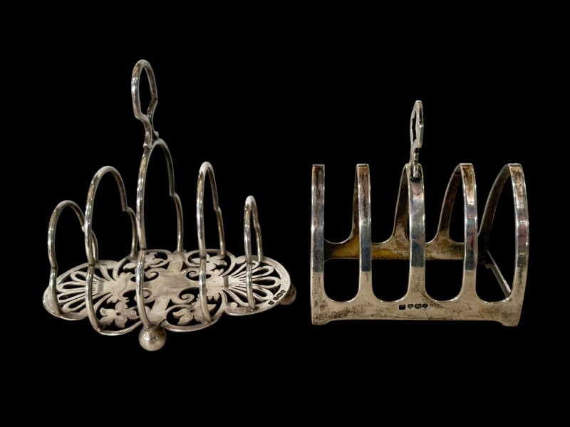 Two silver five bar toast racks, Sheffield 1902 and 1933.