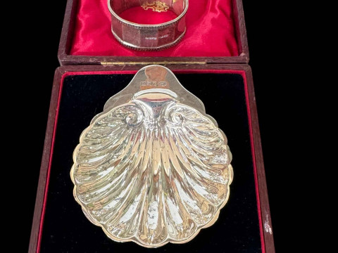 Cased silver shell shaped butter dish, Birmingham 1915, and two silver...