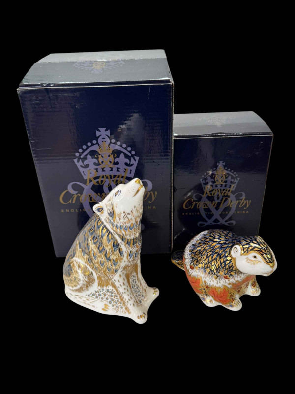 Two Royal Crown Derby paperweights, Wolf and Riverbank Beaver, boxed.
