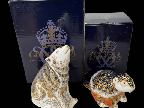Two Royal Crown Derby paperweights, Wolf and Riverbank Beaver, boxed.