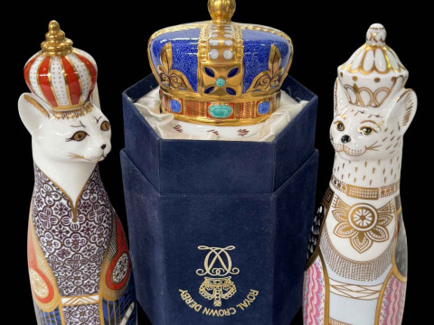 Three Royal Crown Derby paperweights, two Royal Asasinyan and Burmese...