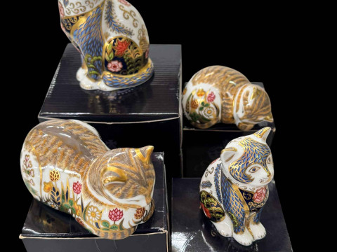 Four Royal Crown Derby paperweights, Fireside Cat and Kitten, and Cottage...