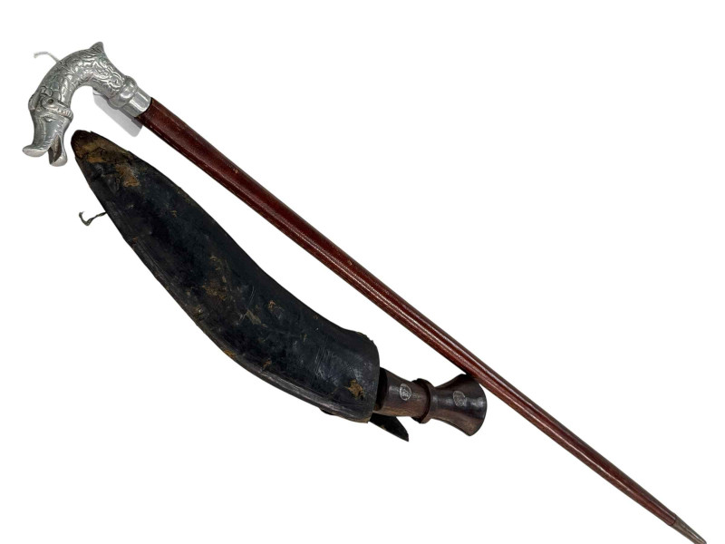 Sword stick and Kukri knife (2). This lot is not for sale to people under the age of 18. By bidding on this item you are declaring that you are 18 years of age or over. Please be aware that we are unable to send weapons or bladed products by postal courier to a UK residential address (Offensive Weapons Act 2019).