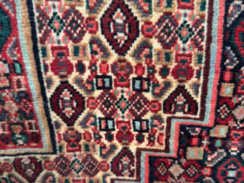 Red ground Persian wool rug, 167cm by 126cm. thumbnail