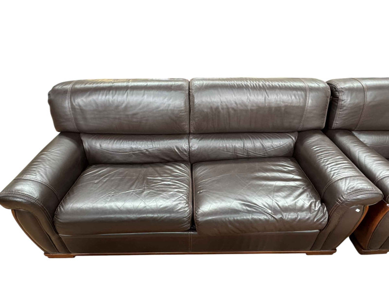 Ferrari leather and mahogany three seater settee and chair.