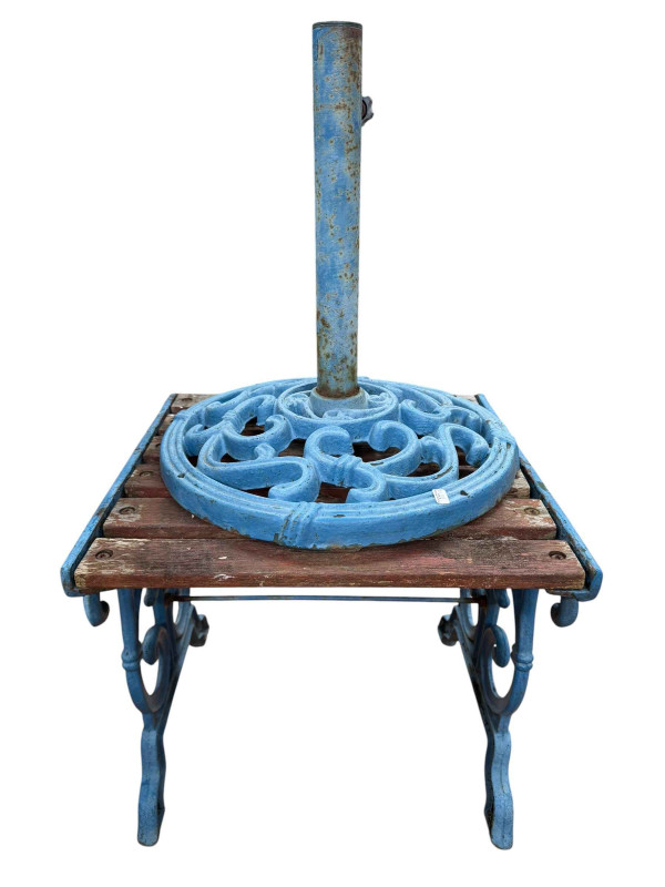 Cast iron and wooden Latha garden bench and pair of matching chairs, small table and parasol stand.