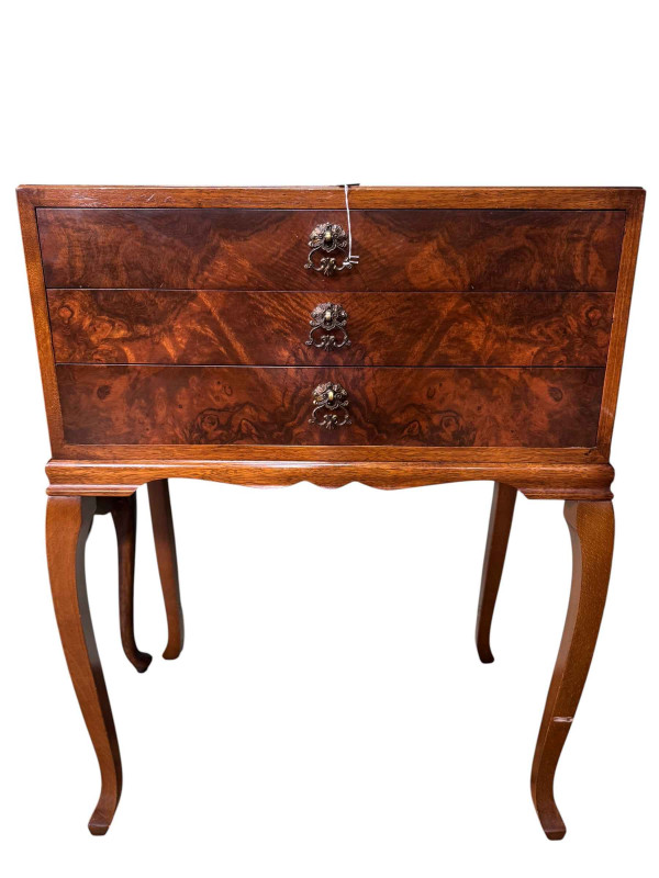 Walnut three drawer pedestal with cutlery, walnut circular nest of five table and mahogany circular two tier occasional table.