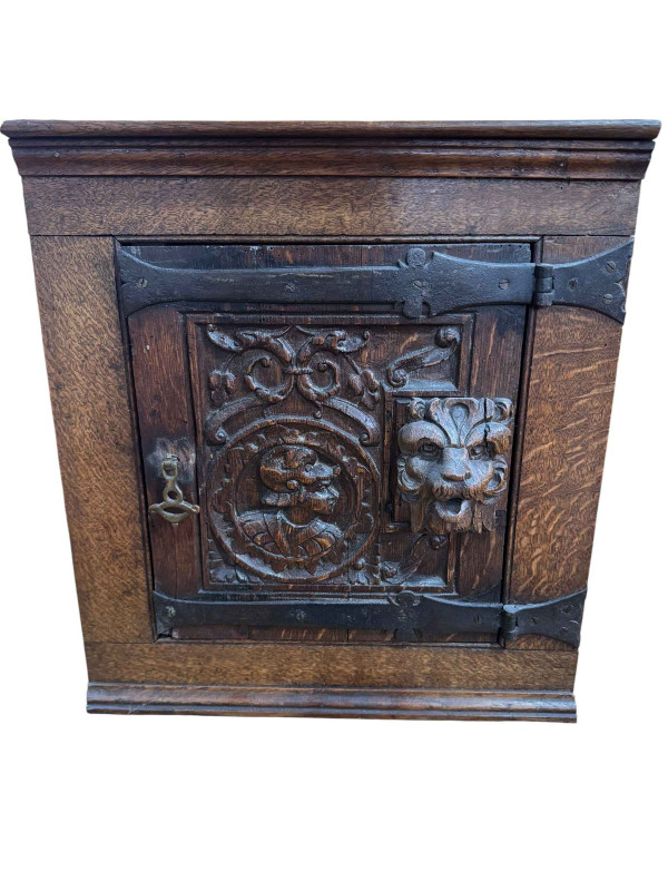 Small antique carved oak corner cabinet.