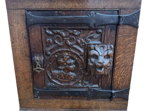 Small antique carved oak corner cabinet.