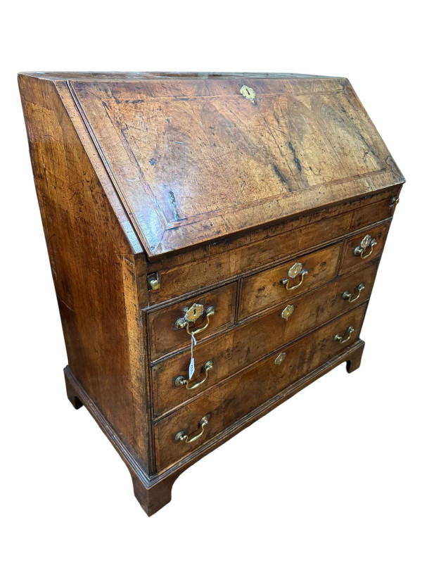 18th Century walnut bureau with well fitted interior above three frieze drawers and two graduated drawers on bracket feet, 90cm by 52cm by 98cm.