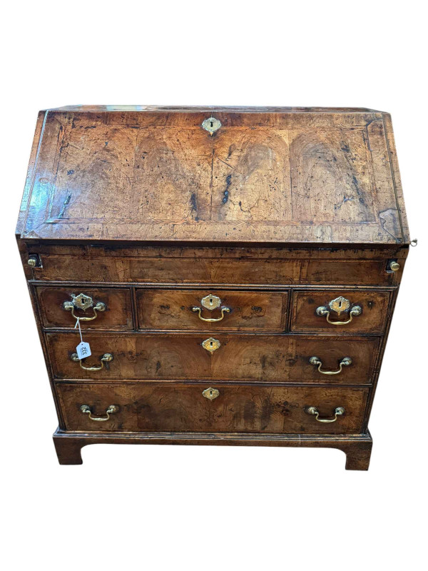 18th Century walnut bureau with well fitted interior above three frieze drawers and two graduated drawers on bracket feet, 90cm by 52cm by 98cm.