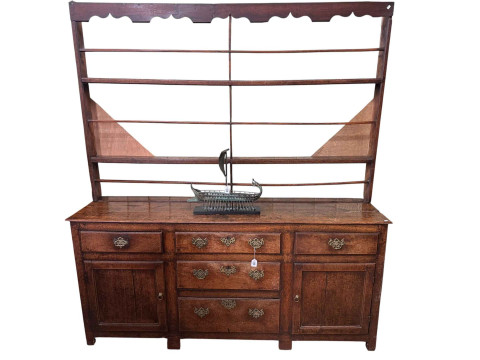 Georgian oak dresser with Delft rack, the base having three graduated...