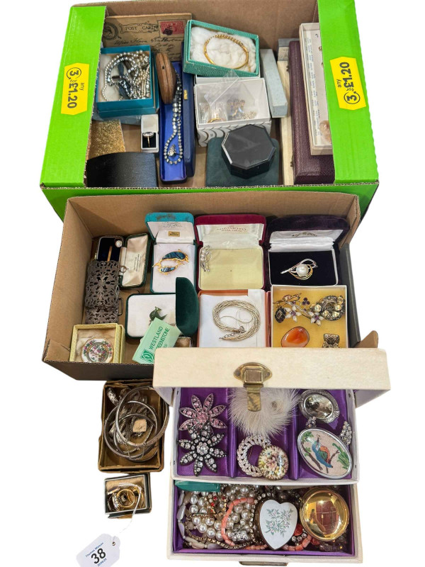 A collection of assorted costume jewellery including rings, brooches, silver badges, etc.