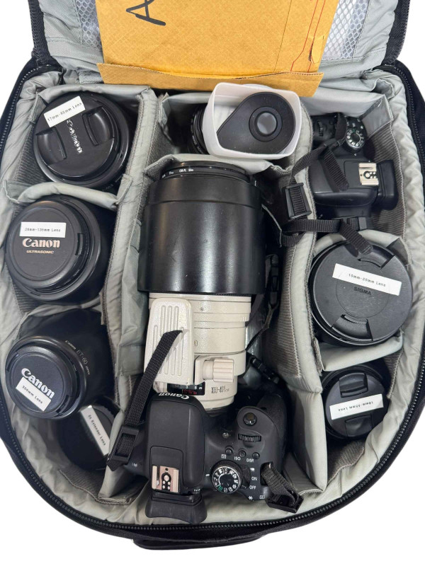 Good collection of camera equipment including two Canon EOS 750D camera's with a selection of lenses including ET-83C and others, commemorative coins and exhibition stamp.