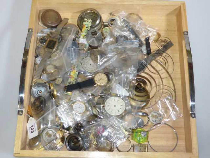 Box of watches and watch parts.
