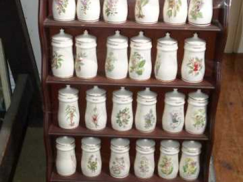 Collection of thirty flower fairy spice jars with rack.