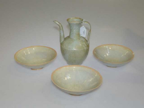 Three Chinese celedon bowls and a wine jug.