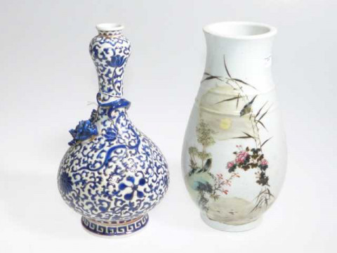Chinese blue and white dragon vase and a floral and bird decorated vase.