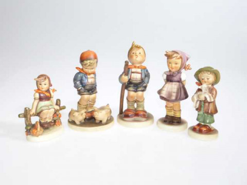 Five Hummel figures.