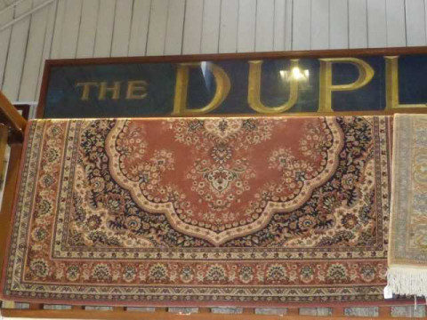 Rose ground Belgian wool carpet, 2.40 by 1.70m