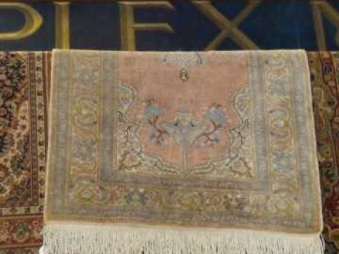 Pink ground Persian design rug, 1.50 by 0.90m