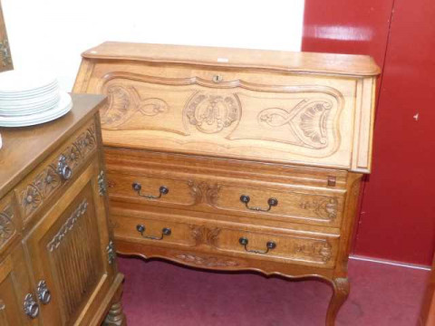 Carved oak French two drawer bureau